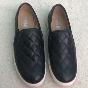 Black Slip ons.